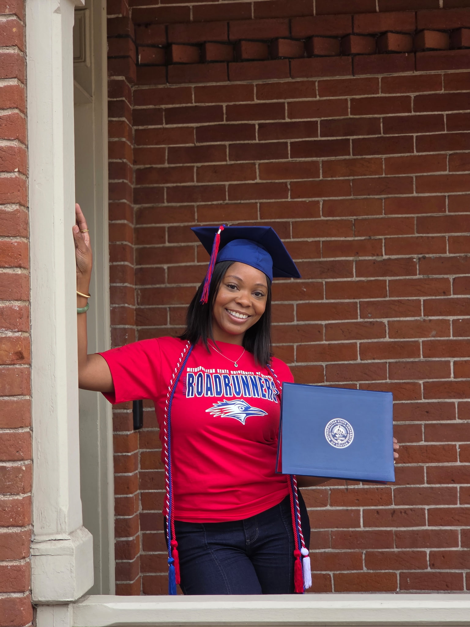 Stacy Berry holding her diploma