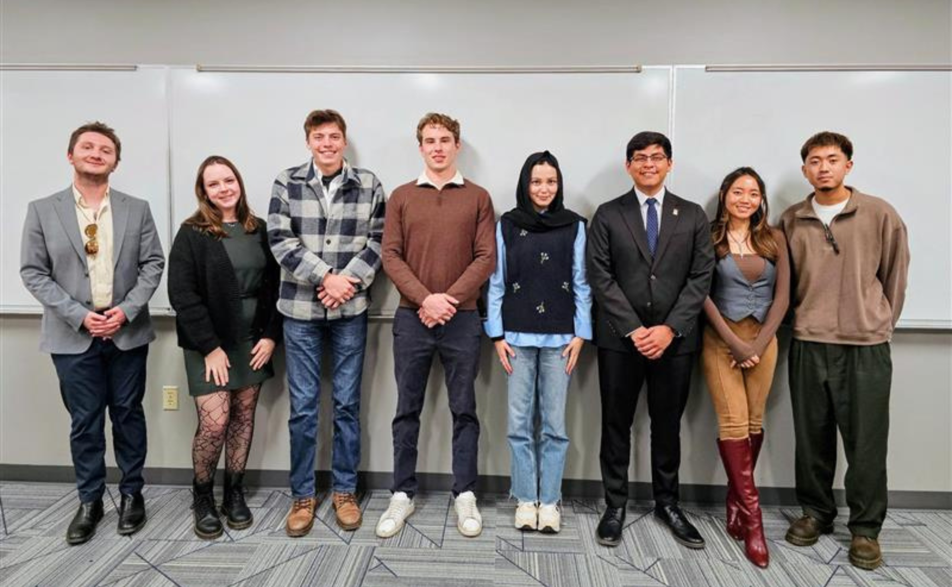 8 MSU Denver Students stand in a line for a picture