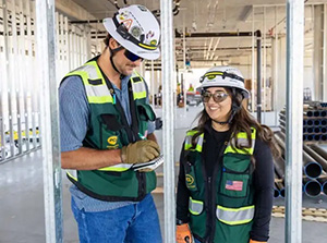 MSU Denver alumnus and PCL Senior Project Engineer Owen Reynolds with Civil Engineering Technology student and PCL intern Claudia Carrillo on the site of MSU Denver’s Summit House.