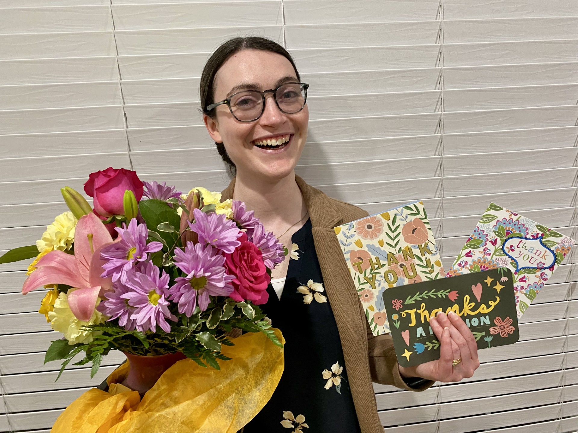 Lauren Shaffer after the SP'26 ASO Banquet with thank you cards and flowers