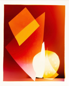Abstract composition with overlapping red, orange, and yellow geometric shapes.