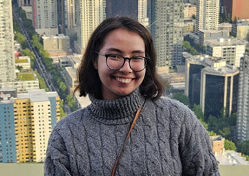 Headshot of Natasha Neff in front of a city background
