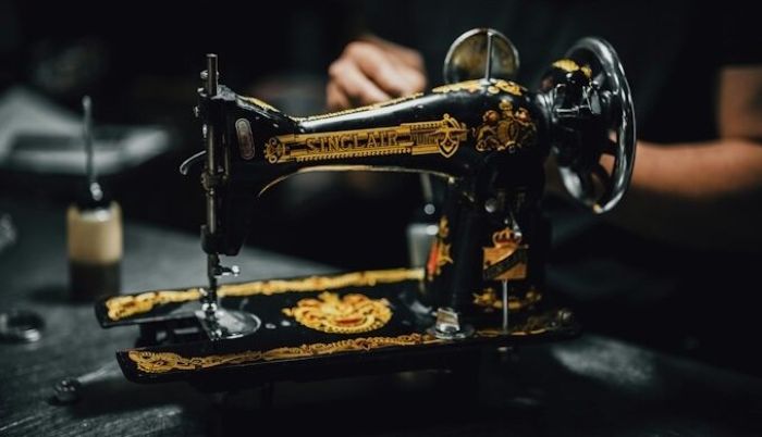 An image of a vintage Sinclair sewing machine on a table