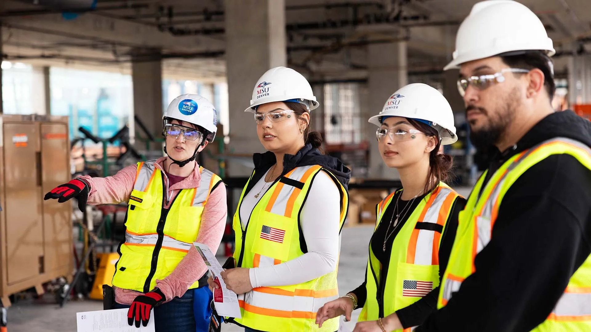 From left to right, Carolyn McGary, assistant professor and director of Construction Project Management in the Department of Engineering and Engineering Technology, chats with her students Kimberly DeSantiago and Casandra Chacon during the Summit House construction tour.
