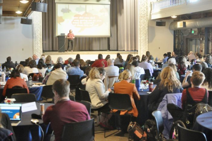 T4L Conference attendees sit listening to Michelle Miller's keynote presentation