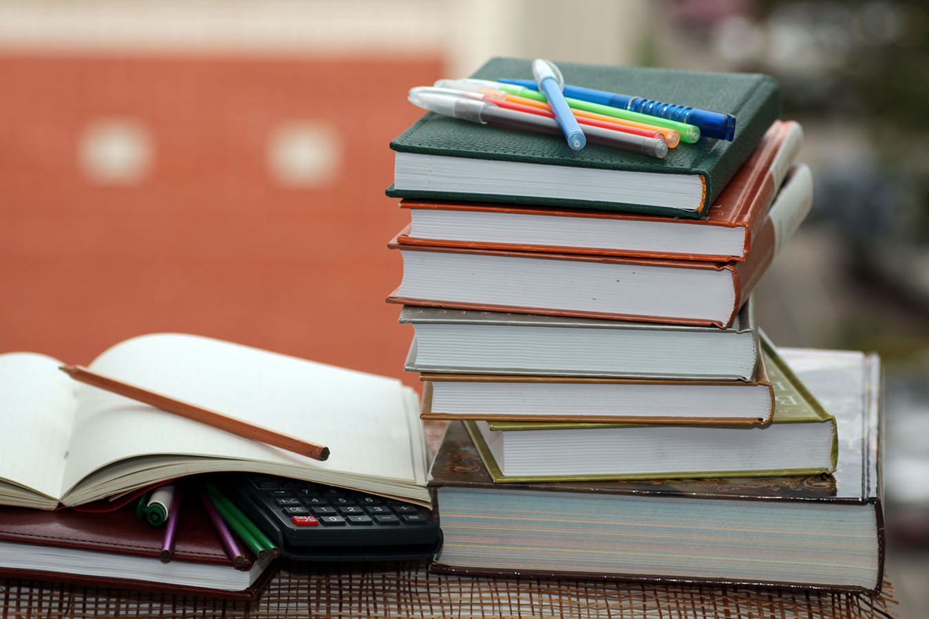 decorative image of a stack of text books