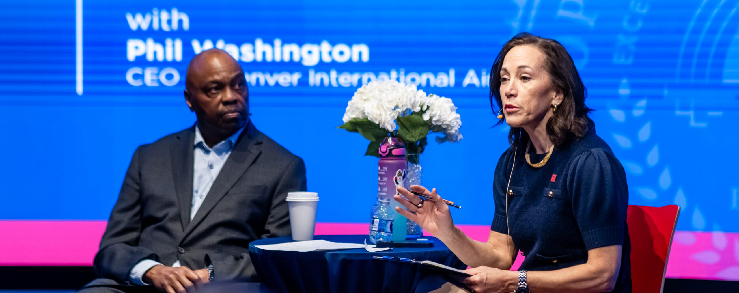 MSU Denver President Janine Davidson, Ph.D., welcomes Phillip Washington, the CEO of Denver International Airport, for a fireside chat in the CAVEA March 9, 2026. Photo by Alyson McClaran