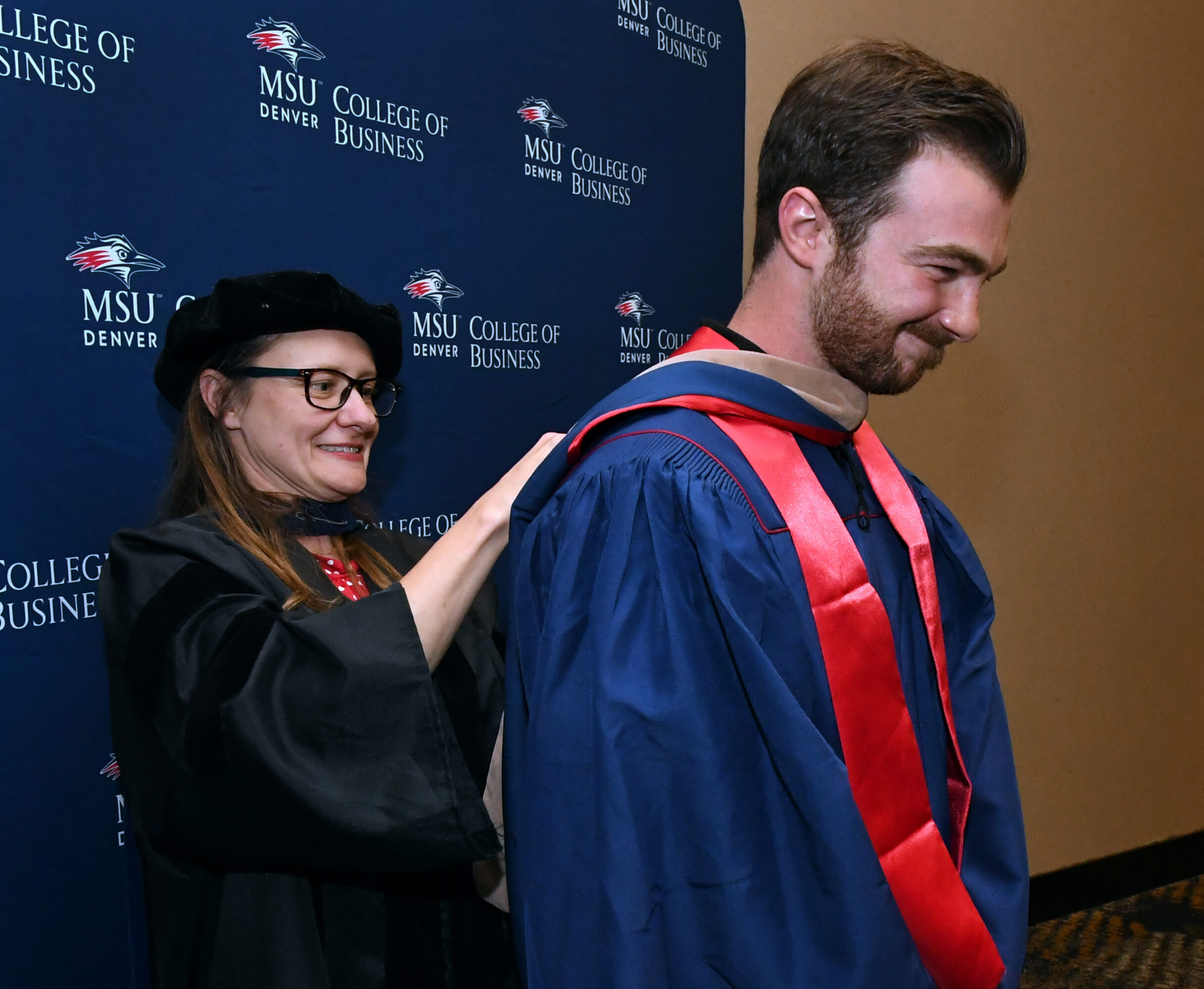 faculty, Letitia, hooding MPAcc grad, Darius at SP'26 MBA & MPAcc Hooding Celebration