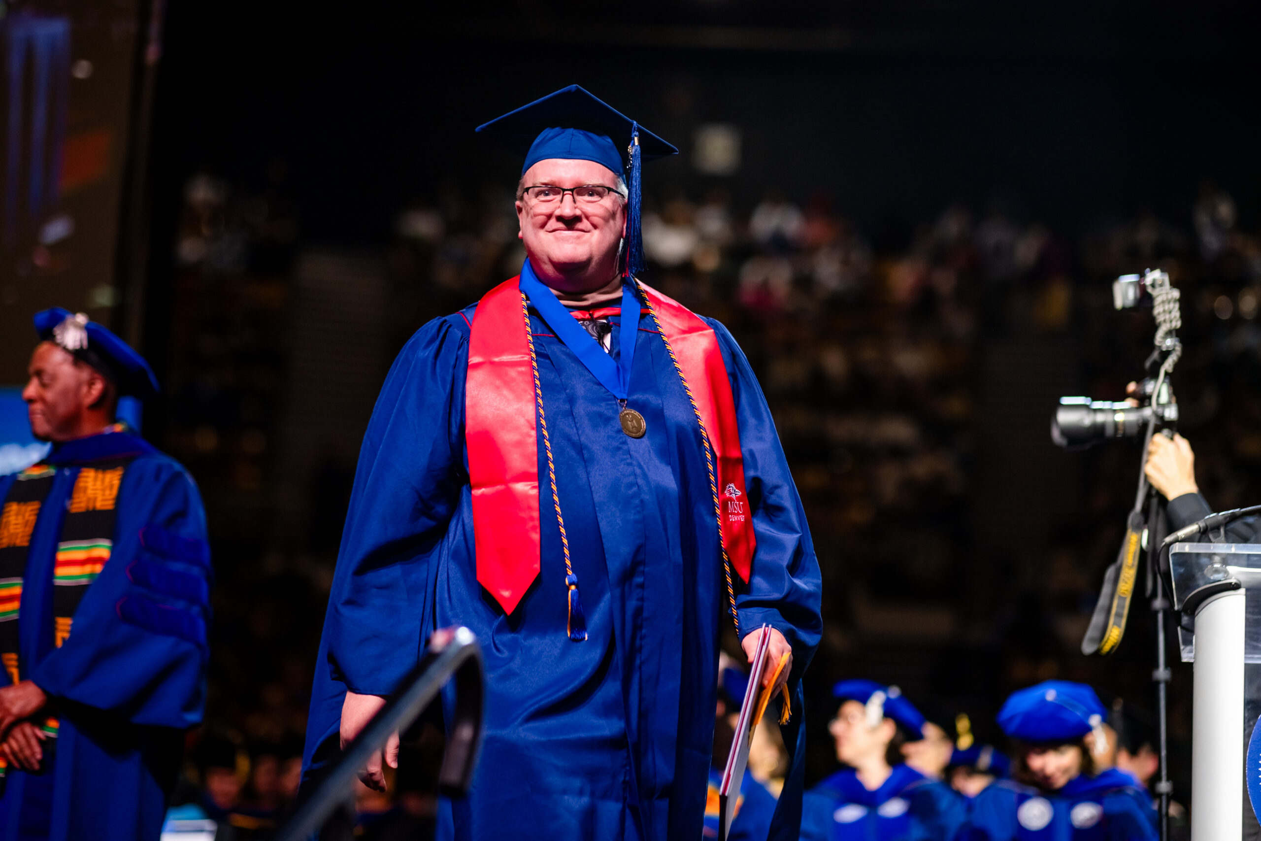 MPAcc grad, Tim Cloran crosses the stage at the university’s morning commencement ceremony on May 15, 2026.