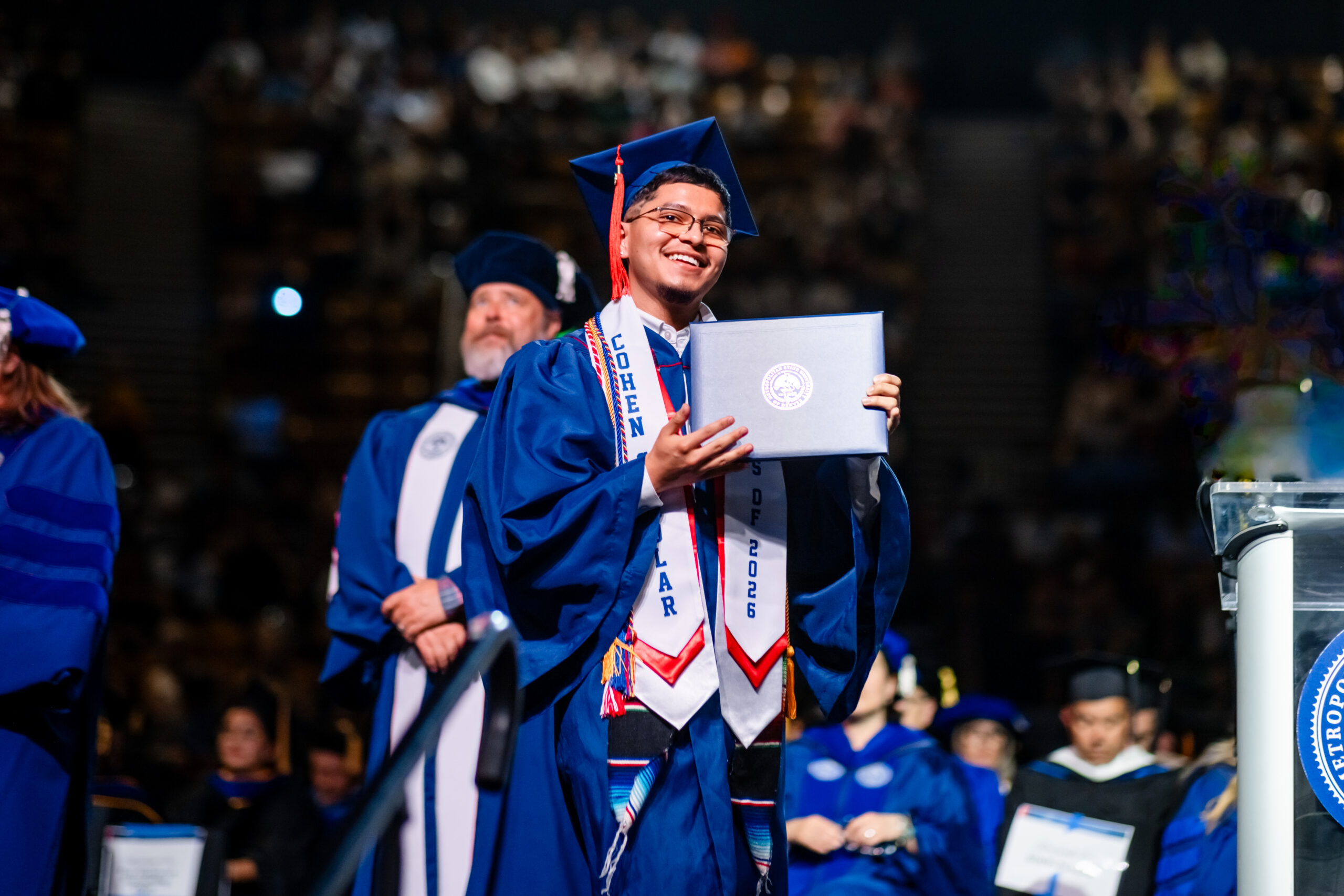 Accounting grad, Christian, crosses the stage at the university’s morning commencement ceremony on May 15, 2026.