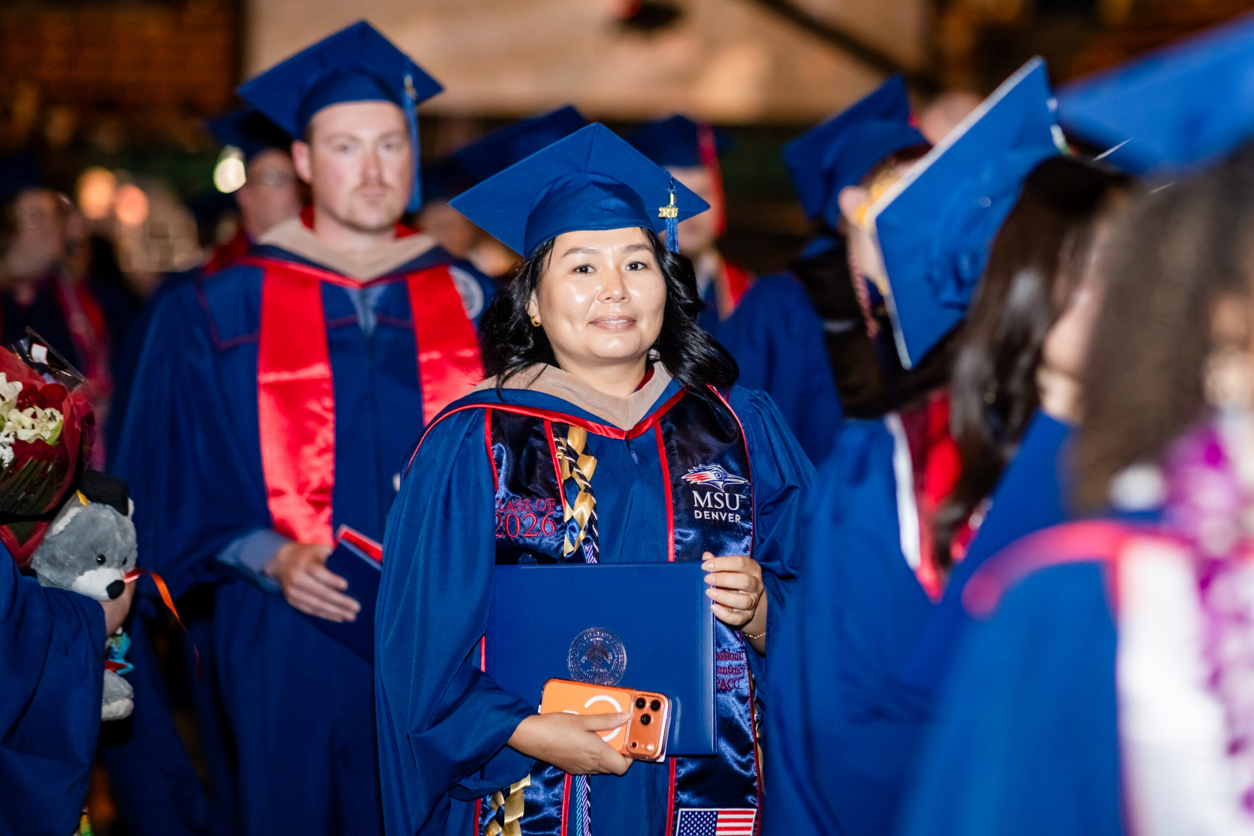 MPAcc grad, Otgontugs, recesses out of the commencement ceremony excited to celebrate with her family