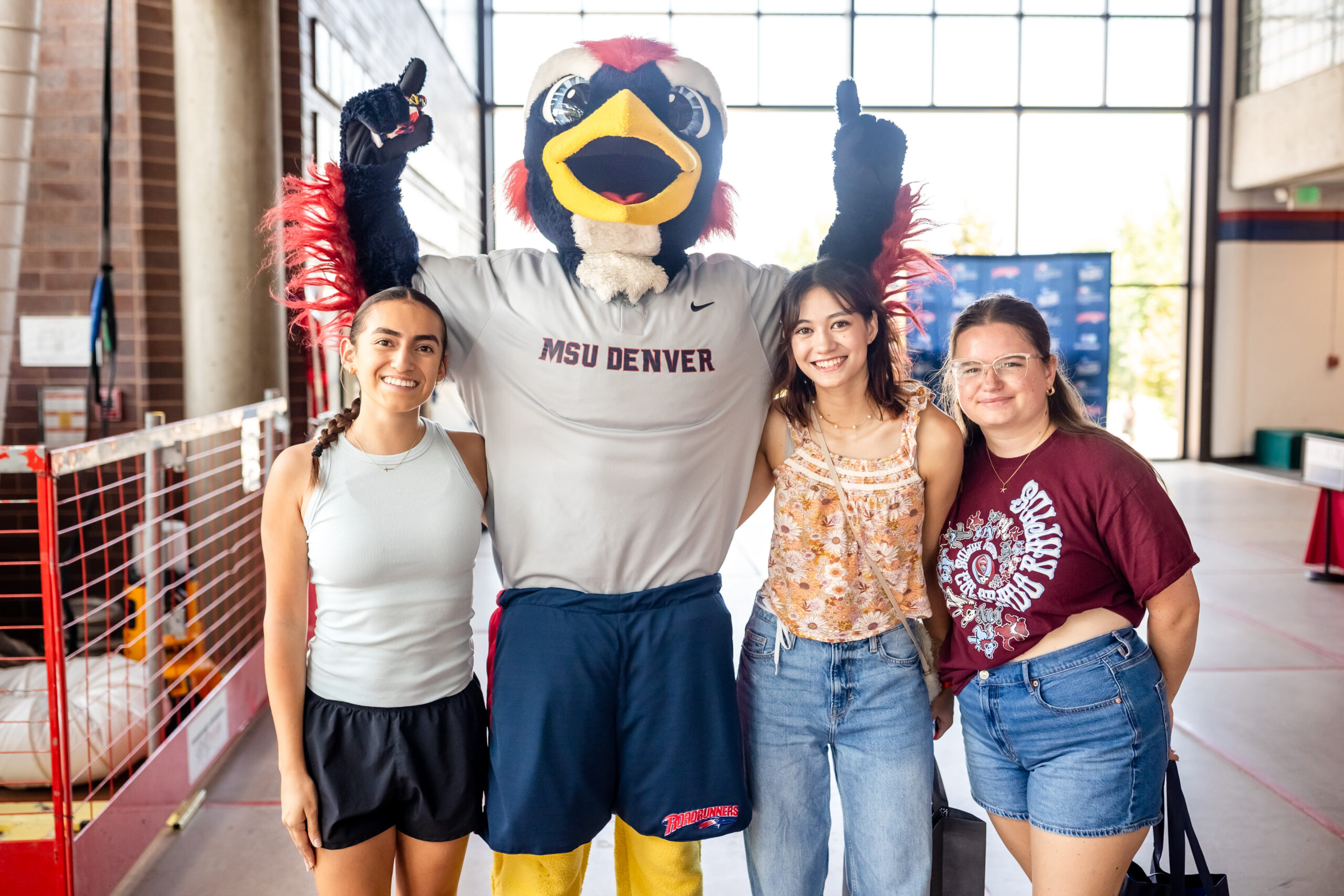 Convocation - Rowdy posing with group of students