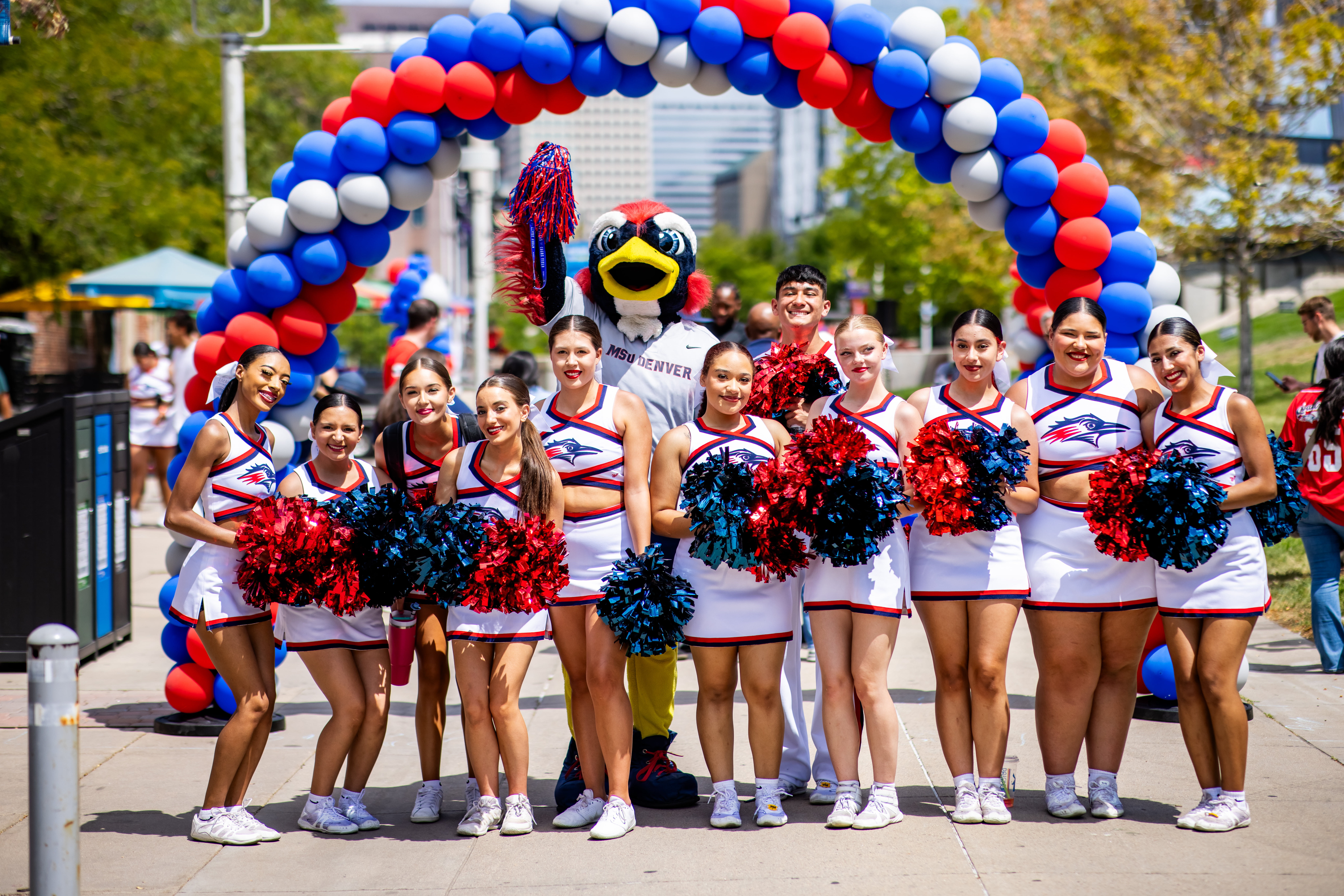 Convocation - MSU Cheer Squad and Rowdy in front of welcome balloon arch
