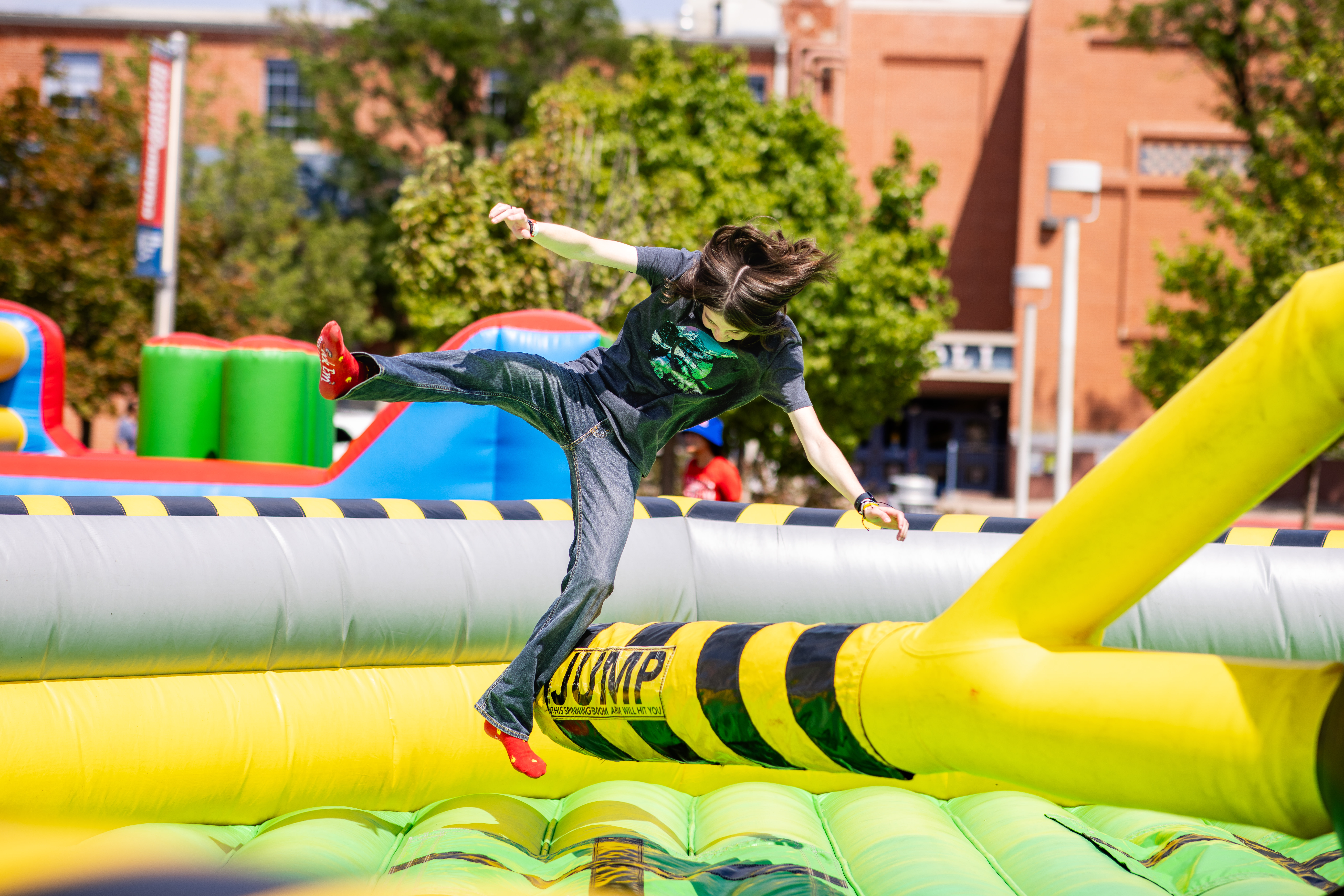 Convocation - student getting swept up by rotating bouncy arm