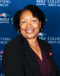 Woman smiling with an MSU Denver backdrop.