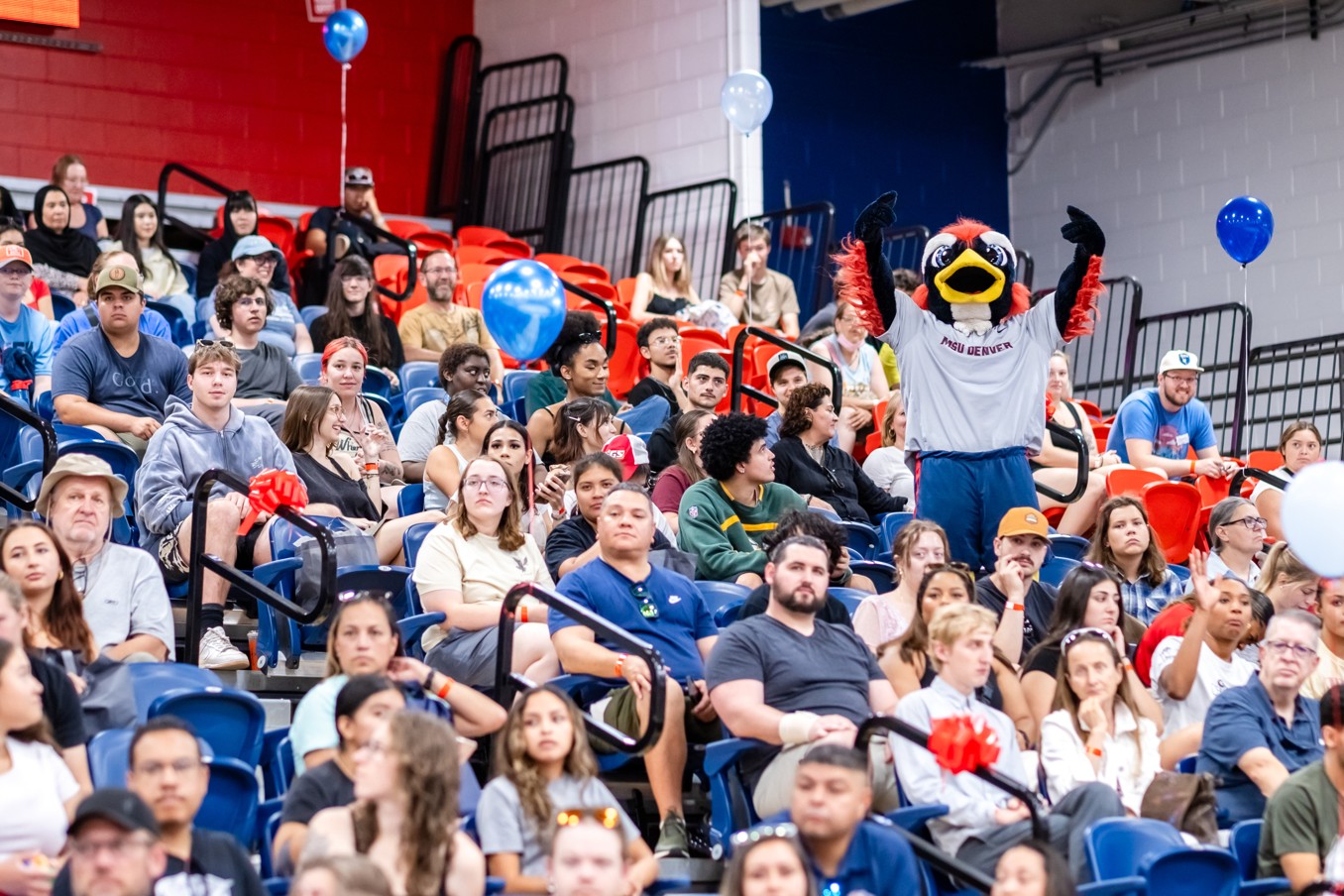 Rowdy the mascot standing in the audience at Rowdy Rally