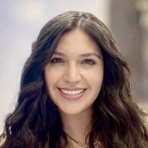 A woman with long wavy brown hair