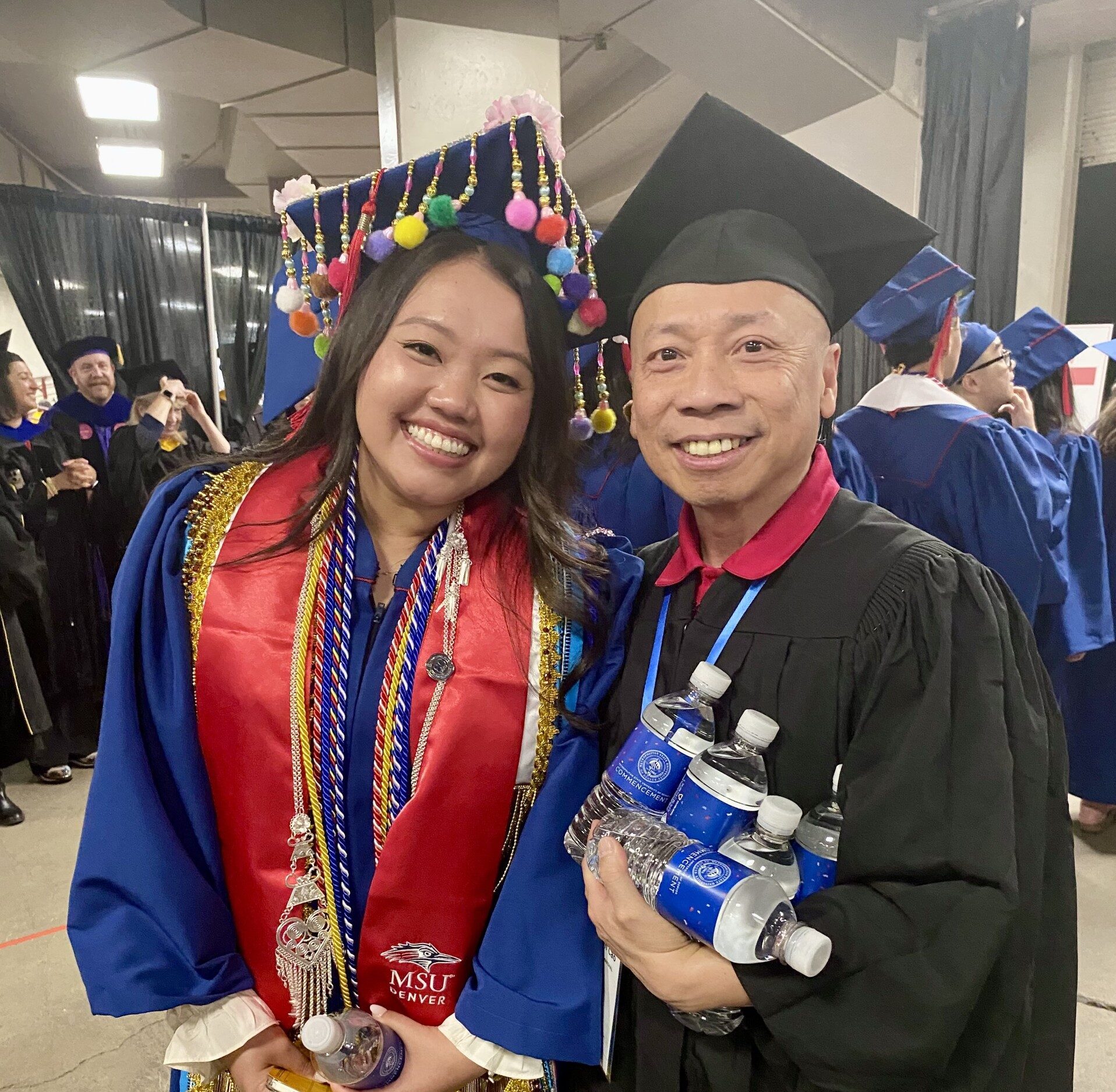 accounting grad and advisor smile before walking into SP'26 Commencement Ceremony