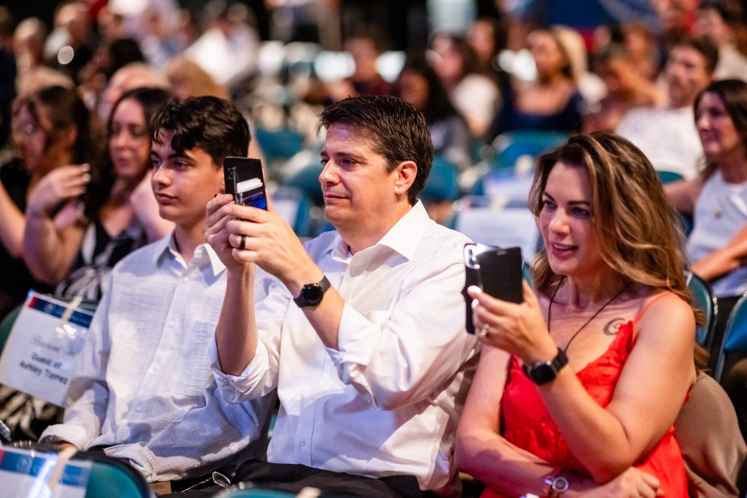 Friends and family members of graduates watch the Commencement ceremony
