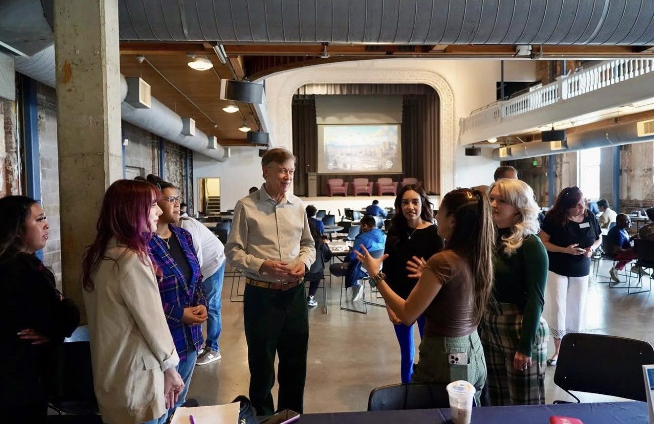 Students talking with a Colorado Senator