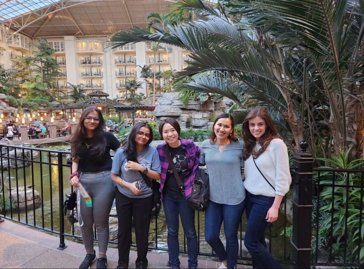 Four ladies standing together at the Women in Cybersecurity conference in Dallas, TX