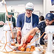 MSU Denver student Ryan Evans turns a pan upside down to release his cupcakes as Stephen Barela of the School of Hospitality steps in to assist.