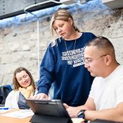 J. Renee Trombley, Ph.D., meets with students, left to right, Andri Cheeks, Brittany Lee, and Adam Nakamura, who are connected through MSU Denver's JustIS Alliance.