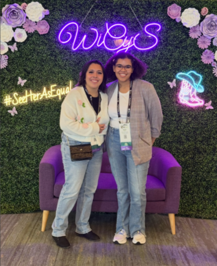Two students at a cybersecurity conference