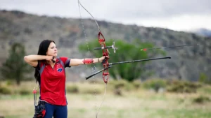 Trinity Weiss, an Environmental Science major and president of the Archery Club, practices at Bear Creek Lake Park. Weiss has helped lead the club's growth into a nationally competitive program. Photo by Alyson McClaran