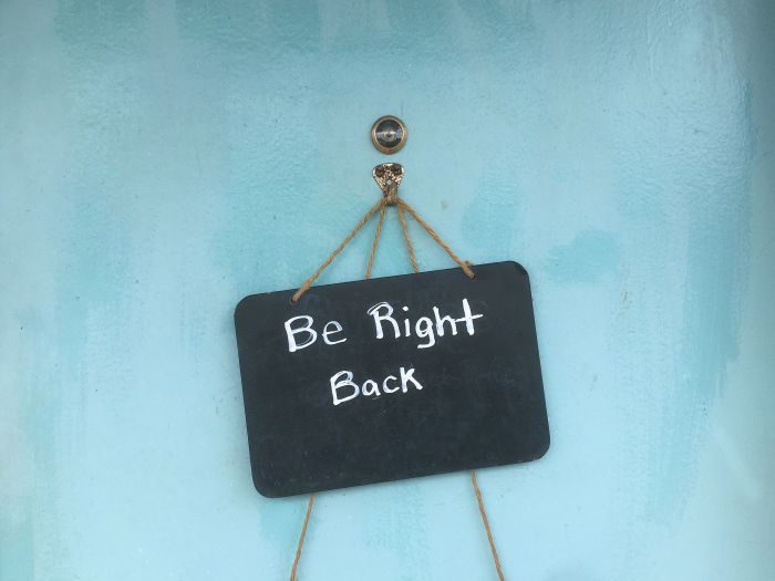 A chalkboard sign reads Be Right Back