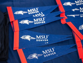 Blue MSU pennants on a table