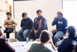 Students speaking on a Brother 2 Brother panel
