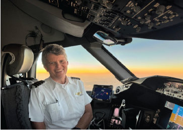 Creston Wilson sits in the cockpit during sunrise