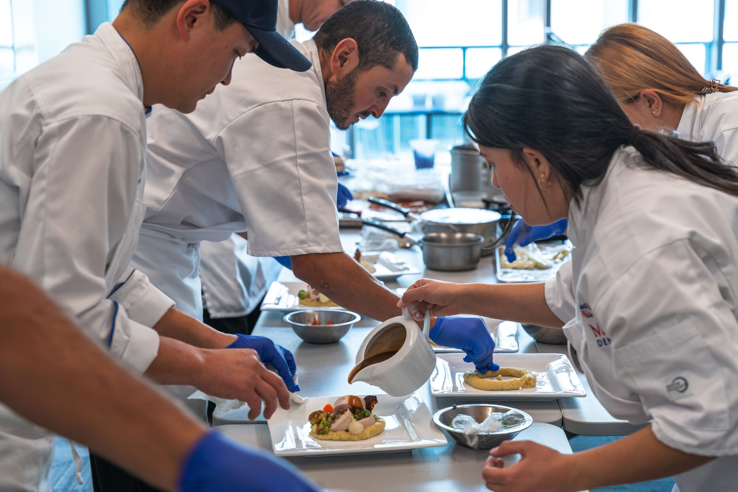 chefs plating food for an event