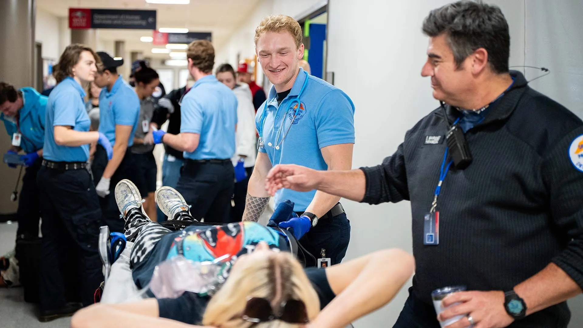 Denver Paramedic students retrieve and care for patient actors with MSU Denver nursing students during a simulation event on Saturday, Nov. 16, 2024. Photo by Josh Geurink
