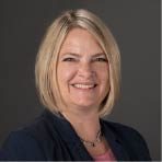 Woman with shoulder blonde hair in a black jacket