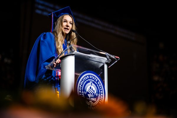 Provost's Award Recipient, Madison Larsen, speaks to her classmates on stage at Commencement