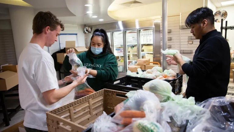 Food-pantry student employee Hannah Hamilton, center, and volunteers Wyatt Falborn, left, and Kolby Bautista pack harvest boxes at Rowdy’s Corner, MSU Denver's expanded food pantry, which will soon open in the Tivoli Student Union. Photo by Amanda Schwengel