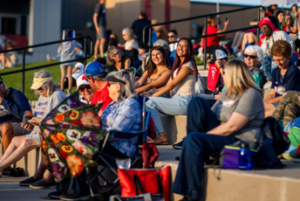 Spectators in stands at soccer match