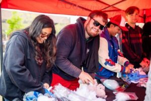 Students stuffing plush toys