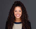 Woman with dark curly hair