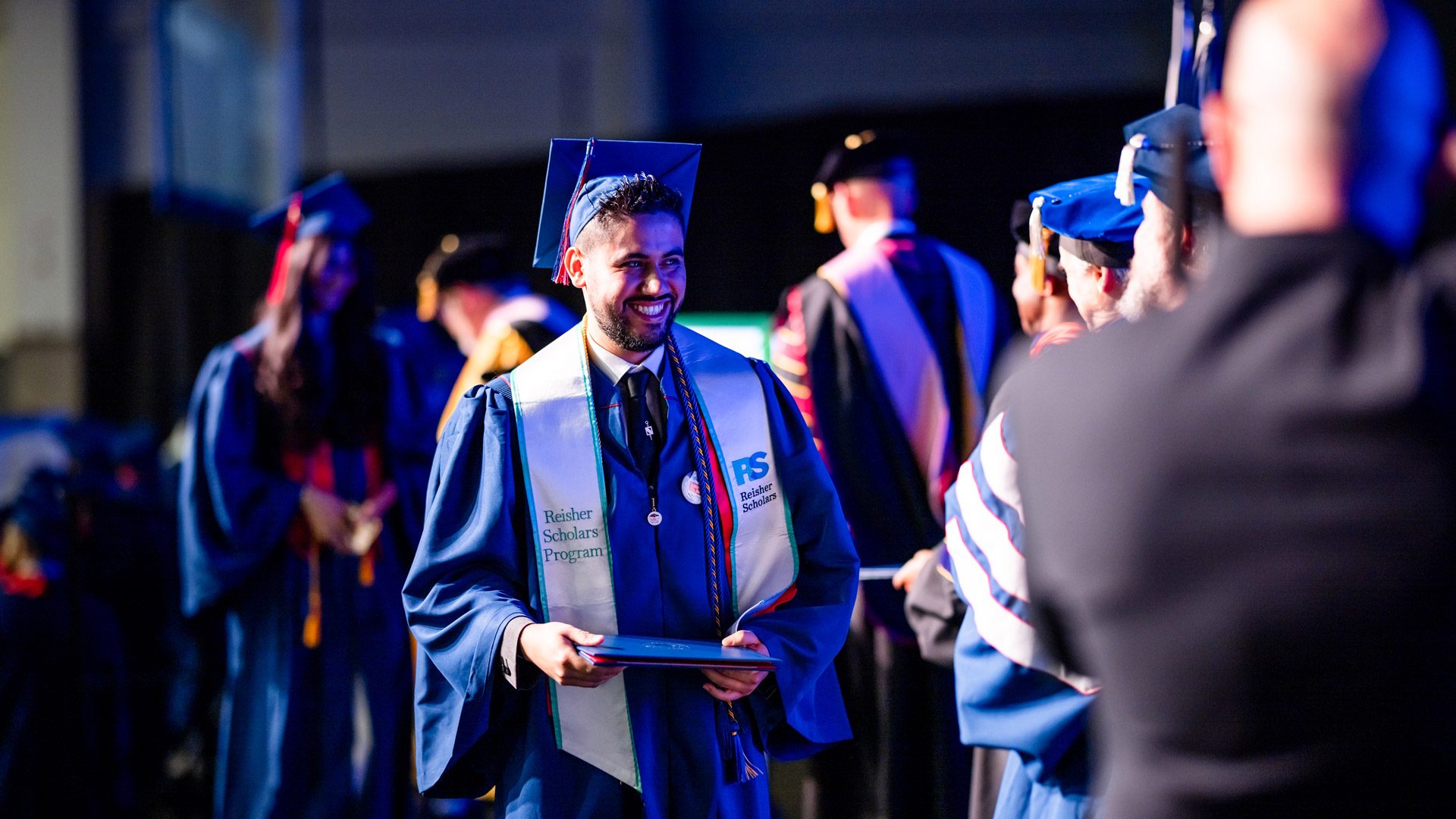 A Reisher Scholar graduate at commencement in Dec. 2025