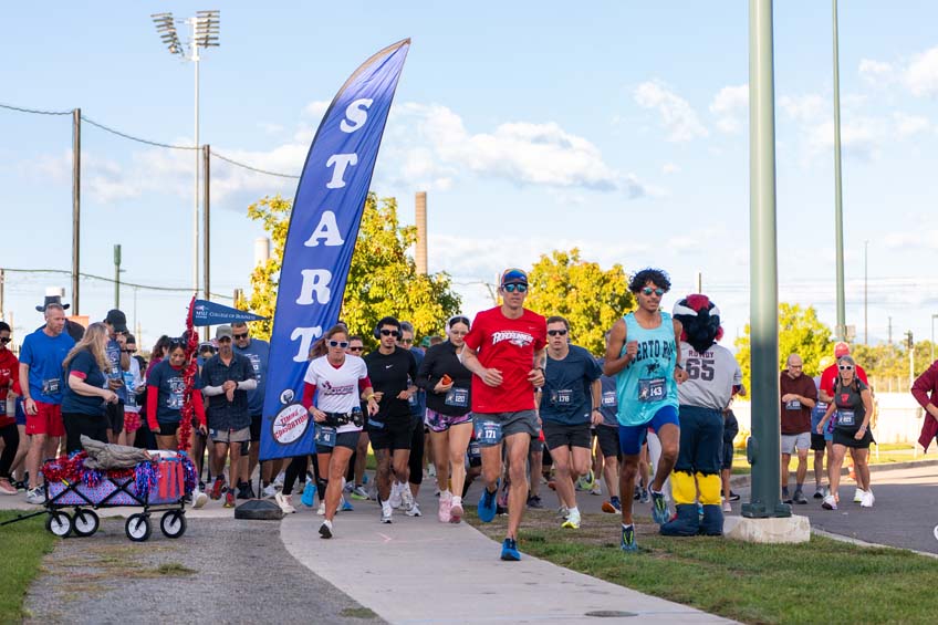 Roadrunners take off from the starting line at the 10th annual Roadrunners 5k.