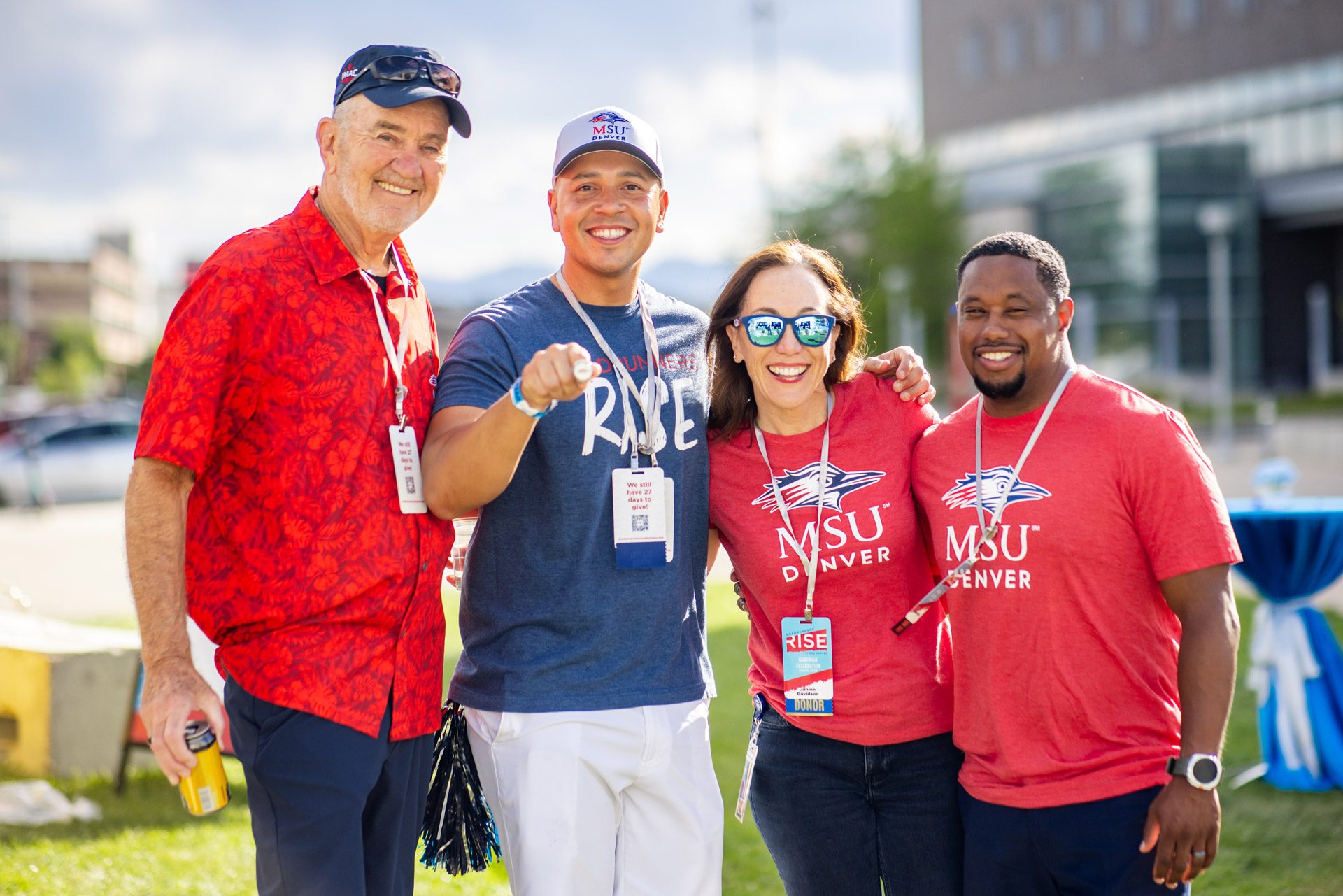 Four people, including President Davidson, posing for a photo at the Rise Campaign celebration in June 2026