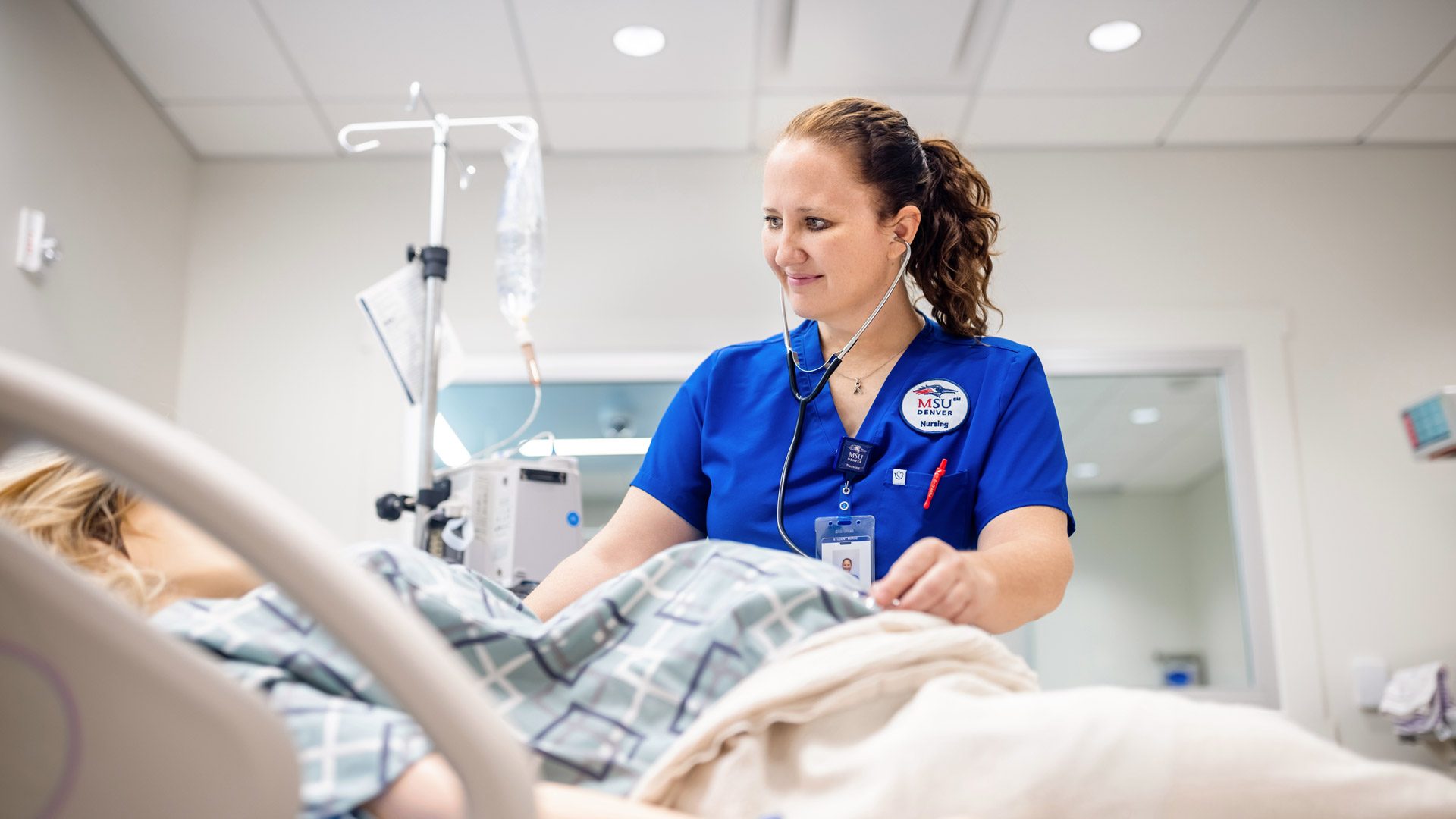 MSU Denver nursing student Angie Peterson practices on a mannequin in the MSU Denver Health Sim Lab