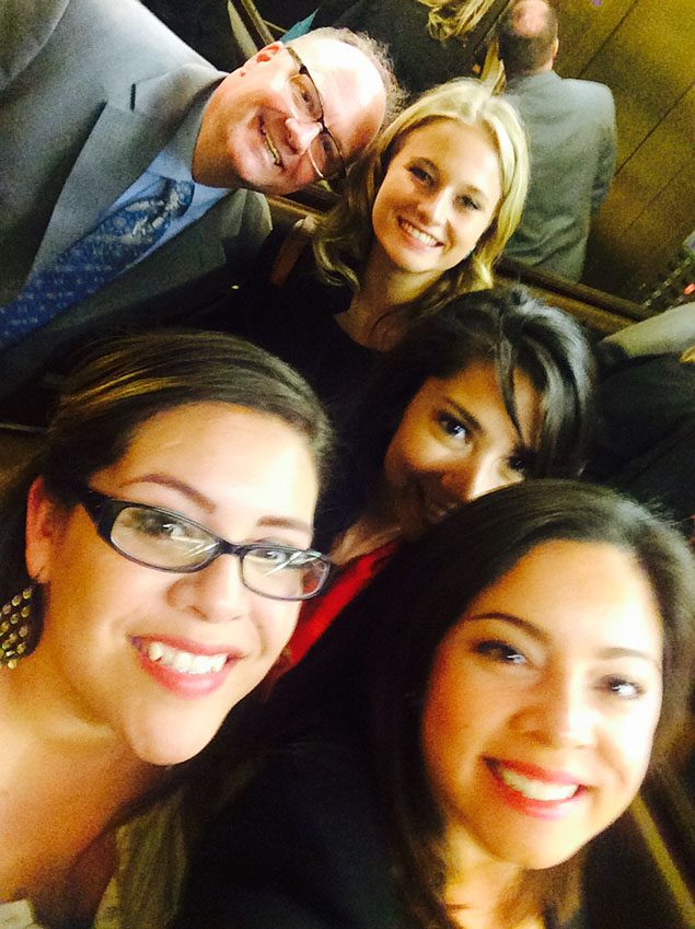 Richard Moeller and four Model UN students in 2015, smiling in a group selfie.
